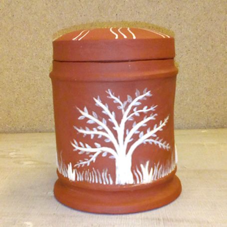 Clay container with a lid, featuring a white tree design and decorative lines.