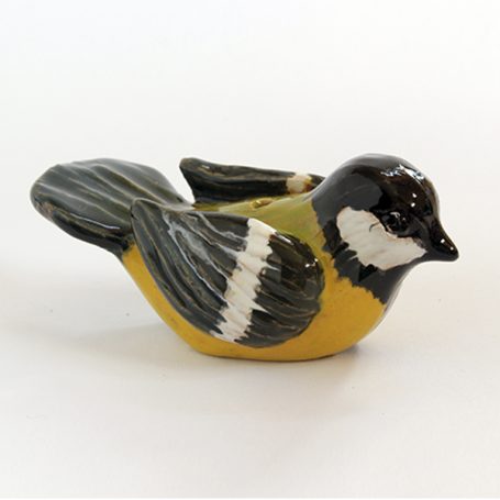 Ceramic figurine of a bird with a black head, yellow belly, and grey wings.