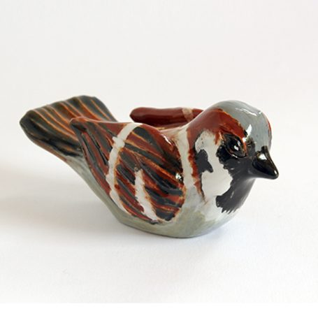 Ceramic sparrow figurine with brown and grey markings.